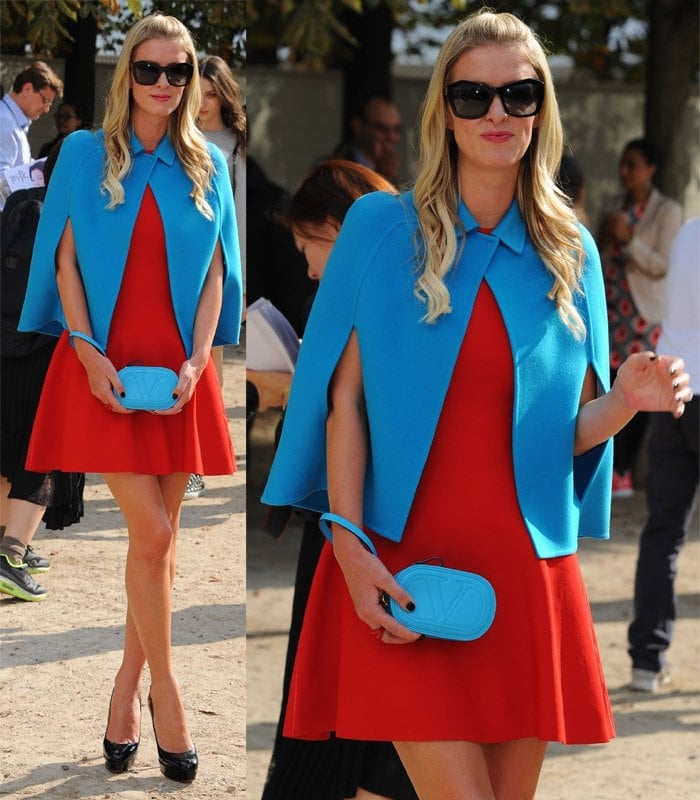 Colorful Contrast: Nicky Hilton dazzles in a red dress and striking blue cropped wool-cashmere cape by Valentino