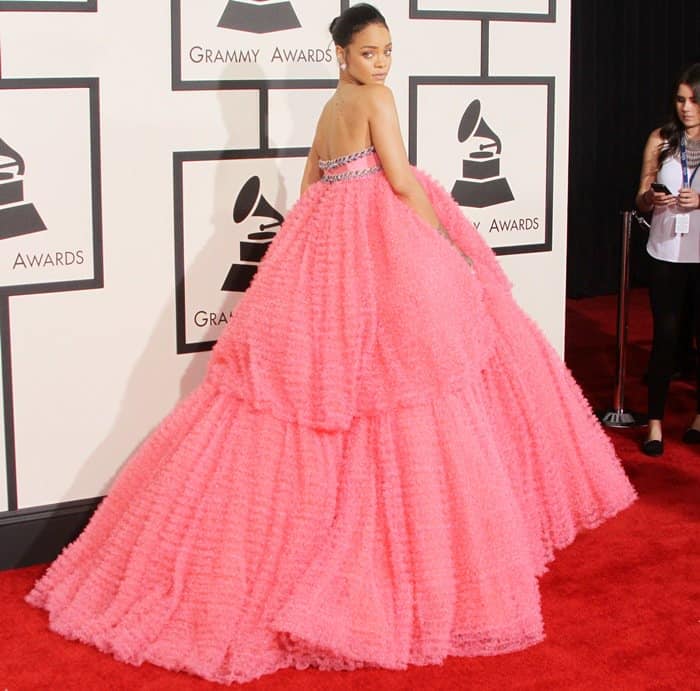 Rihanna's dress is a voluminous, strapless cupcake-pink gown with tiered ruffles and sparkling embellishments