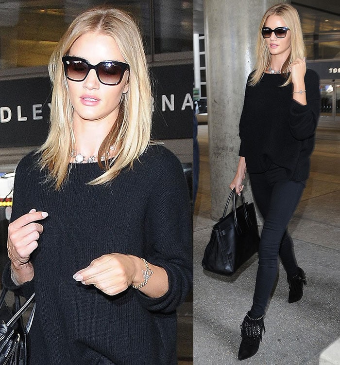 Rosie Huntington-Whiteley in a black knit sweater and skinny jeans