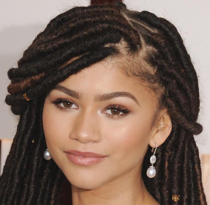 Zendaya making a statement with her elegant dreadlocks at the Oscars - a moment of grace and controversy