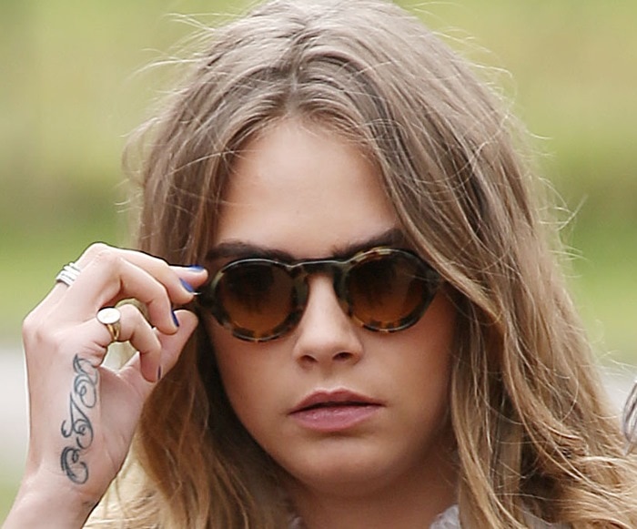 Cara Delevingne's circular leopard print rimmed sunglasses