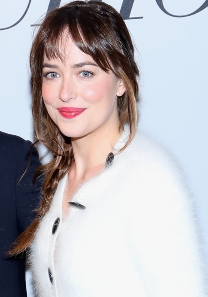 Dakota Johnson's messy braid and fuzzy white Balenciaga sweater