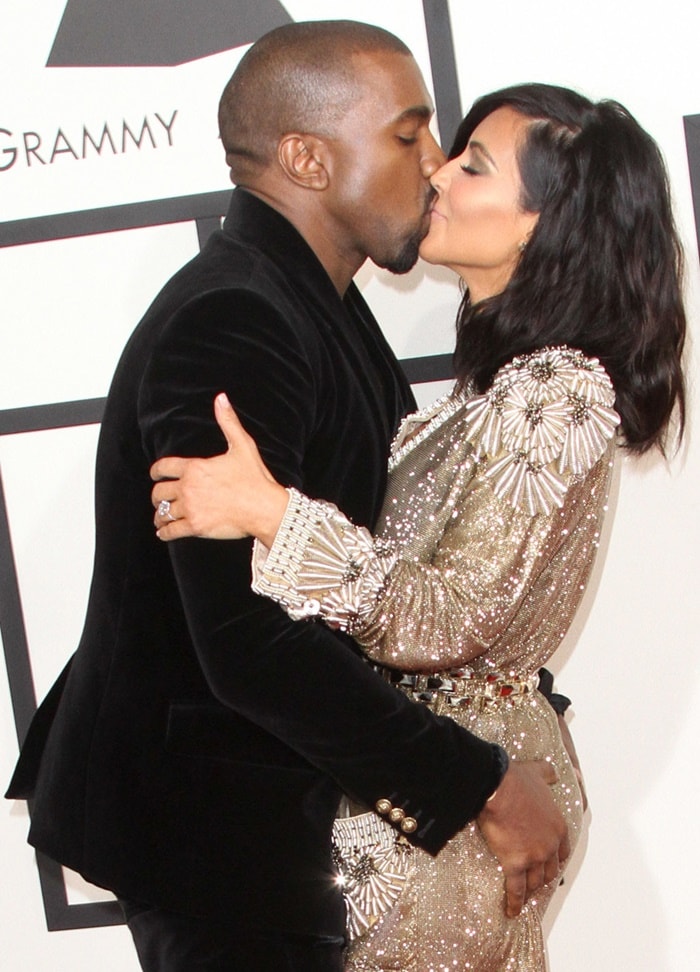 Kanye West grabs Kim Kardashian's backside on the red carpet of the Grammys