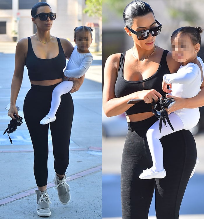 Kim Kardashian sporting raven locks while carrying North West to her ballet class in California on March 26, 2015