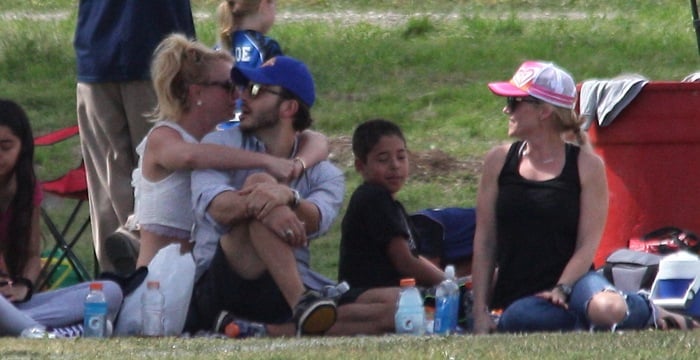 Britney Spears spent a romantic day out holding hands and cuddling up with her boyfriend, Charlie Ebersol, as they watched her sons play soccer in Los Angeles on March 15, 2015