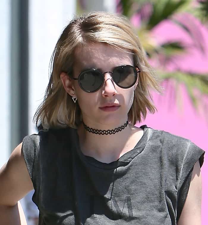 Emma Roberts rocks a tattoo choker necklace with a grey 'I'M NOT SORRY' T-shirt