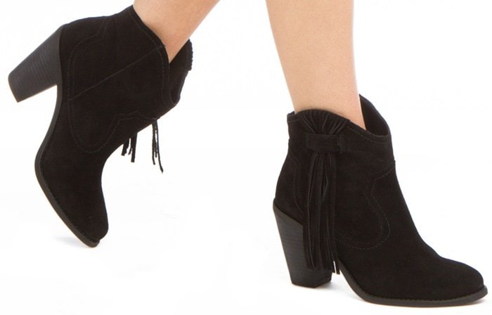 Lush fringe lends Western-inspired appeal to a suede bootie featuring tonal stitching and a sturdy stacked heel