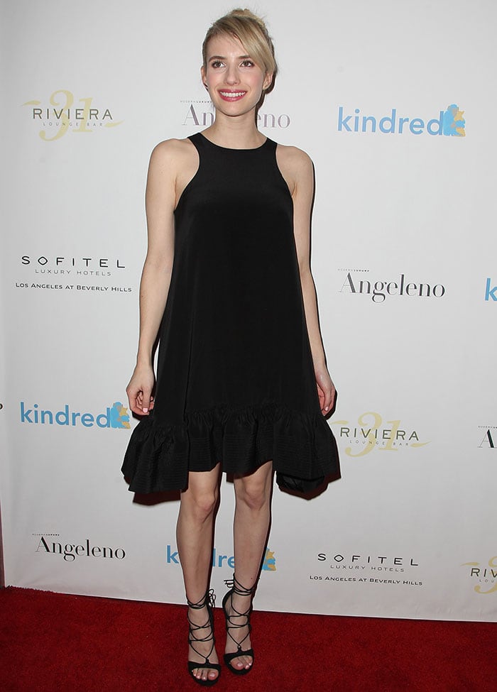 Emma Roberts flashed her legs in a loose-fitting Cynthia Rowley flounce sleeveless LBD