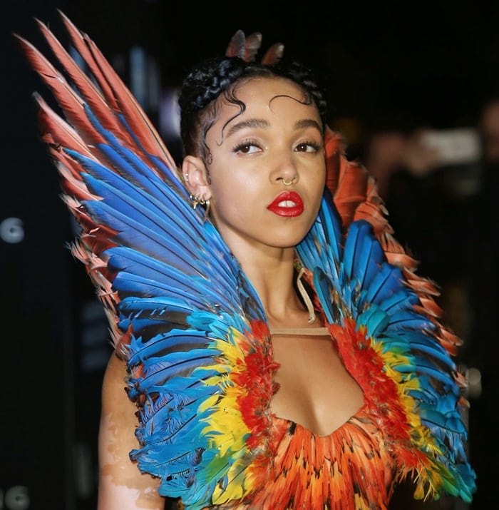 FKA twigs in a rainbow-colored birds-of-paradise dress