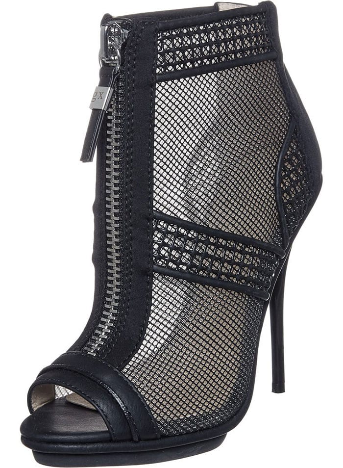 Peekaboo mesh construction amplifies the modern allure of a peep-toe sandal, while faux-leather accents and a polished zipper at the front and center add unmistakable rocker-chic vibes