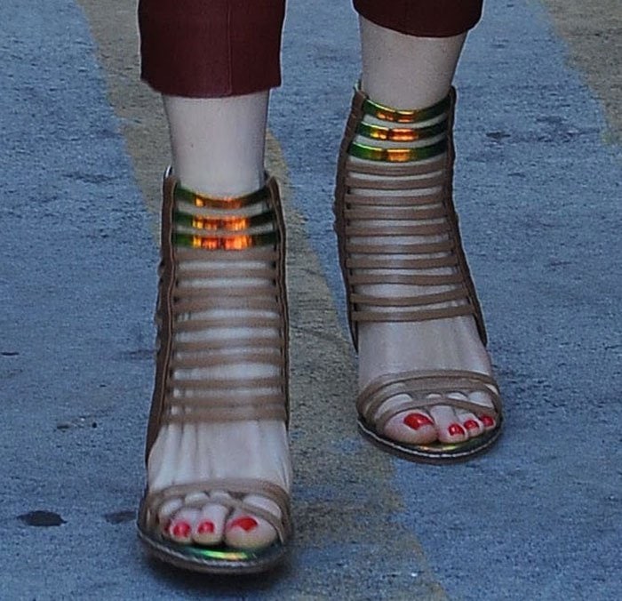 Gwen Stefani displays her pedicured toes in heels from her own footwear label