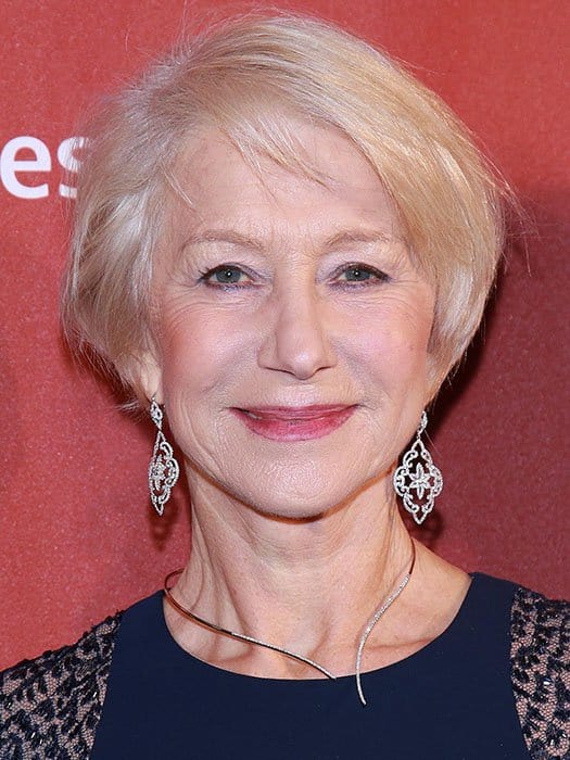 Helen Mirren's ornate dangling earrings and shaped wire necklace