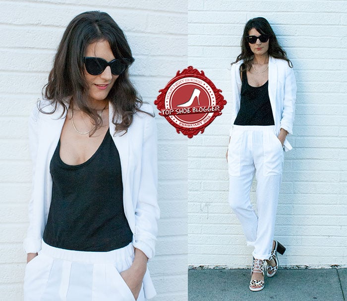 Laura's chic white suit with a black tank top