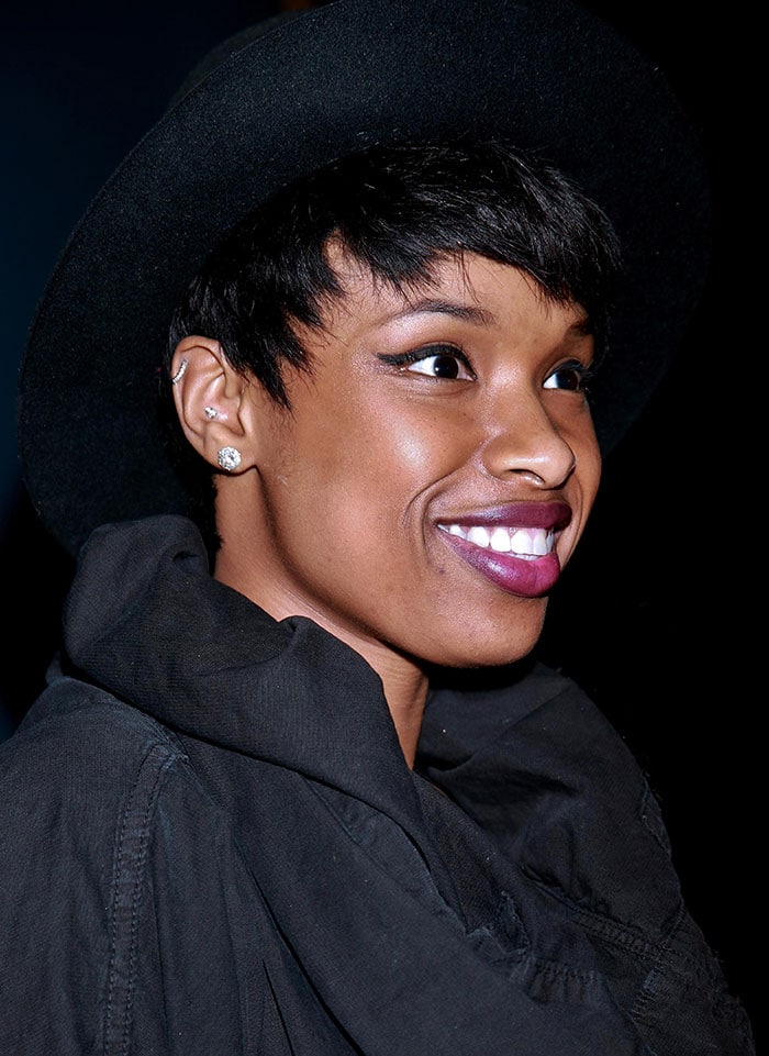 Jennifer Hudson wears a fedora and glittering earrings