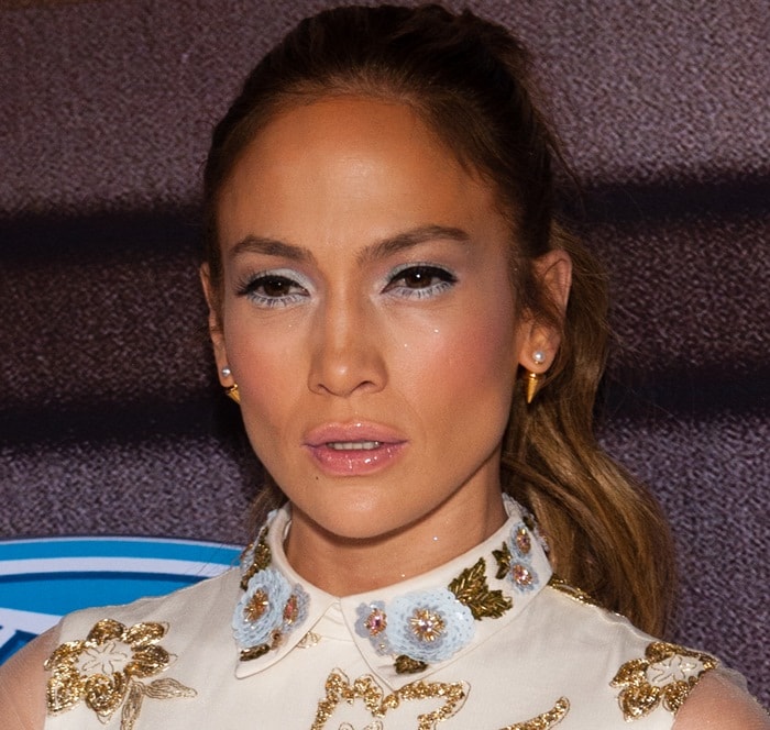 Jennifer Lopez matches her baby blue eyeshadow to the detailing on her Marchesa dress