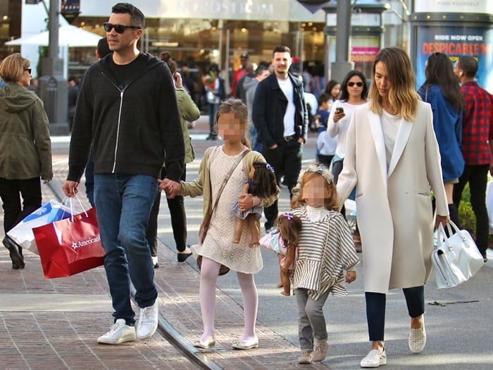 Jessica Alba and husband Cash Warren take their daughters shopping at The Grove in Los Angeles, and they stop by the American Girl Place store, where they bought their daughters some dolls on February 28, 2015