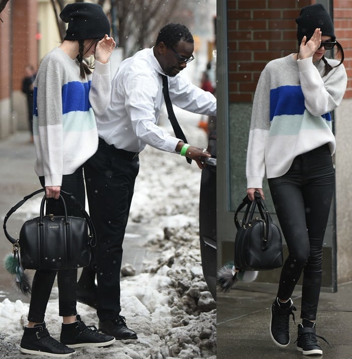 A camera-shy Kendall Jenner braves the snow as she leaves home holding a Givenchy bag in New York City on March 3, 2015