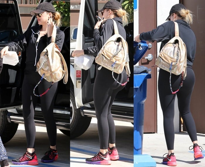 Khloe Kardashian sported black tight black work out gear and a tomboy cap