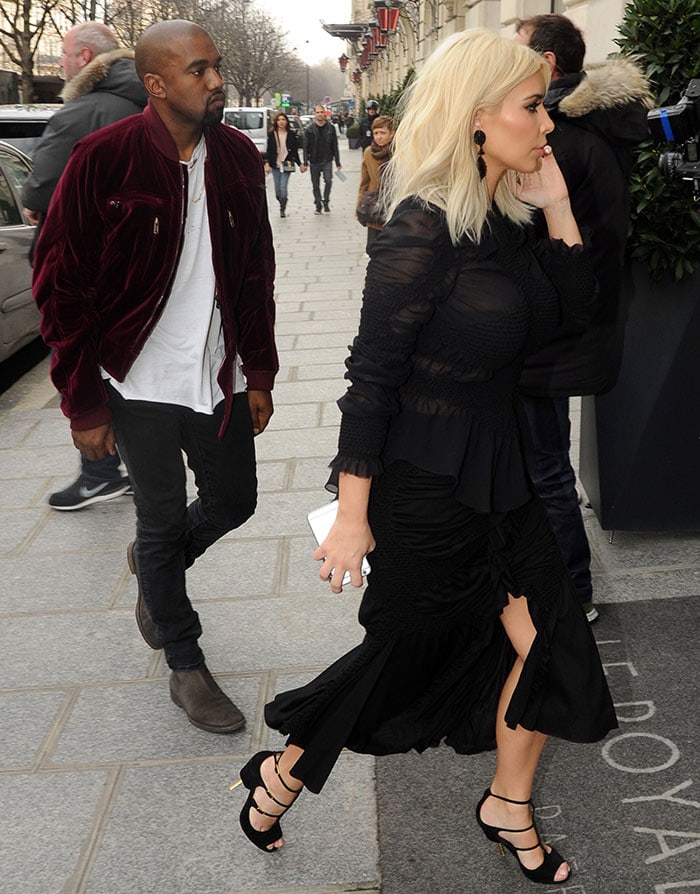 Kim Kardashian and Kanye West visiting a Louis Vuitton store in Paris, France, on March 11, 2015