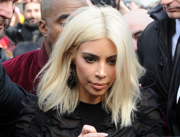 Kim Kardashian's blonde look with winged eyeliner and nude lip color