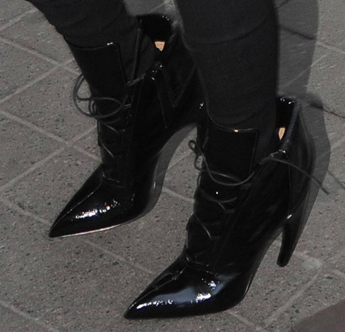 Kim Kardashian wearing boots with curved heels