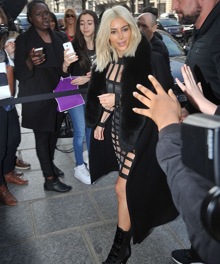 Kim Kardashian leaving a photoshoot wearing a see-through cage dress