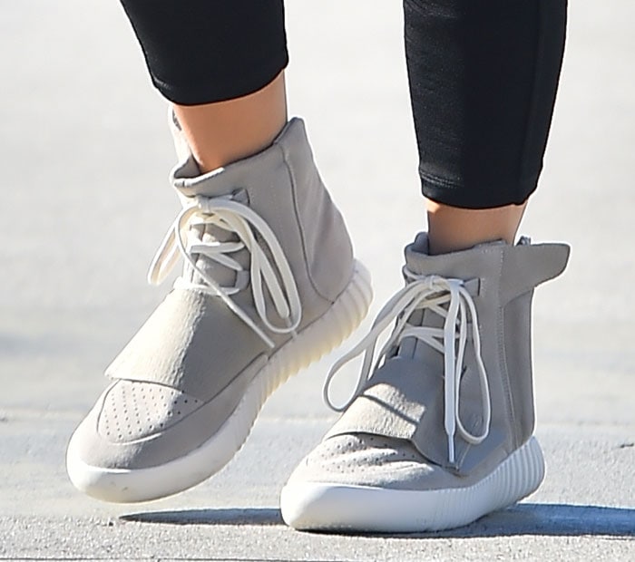 Kim Kardashian wearing Kanye West x adidas Yeezy 750 Boost sneakers