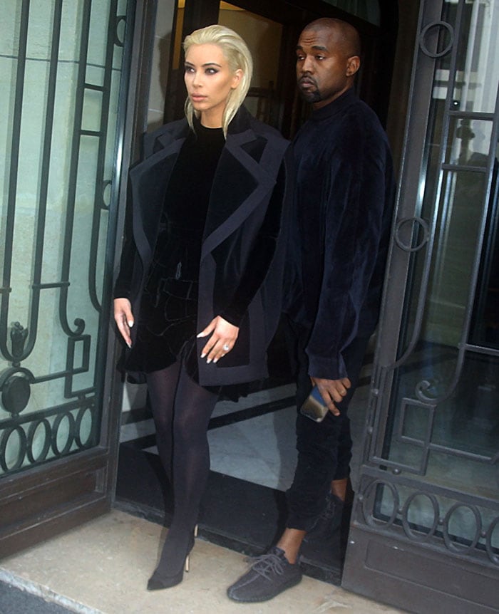 Kim Kardashian wears a velvet long-sleeved top and a ruffled skirt