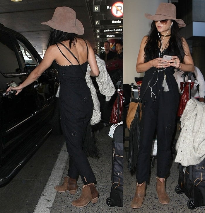 Vanessa Hudgens rocked a simple black jumpsuit and rugged ankle boots
