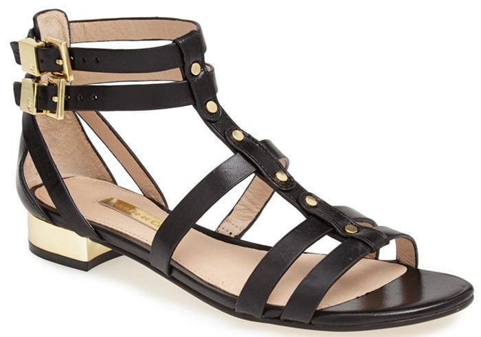 Polished metal accents and studs punctuate a strappy gladiator sandal with of-the-moment attitude