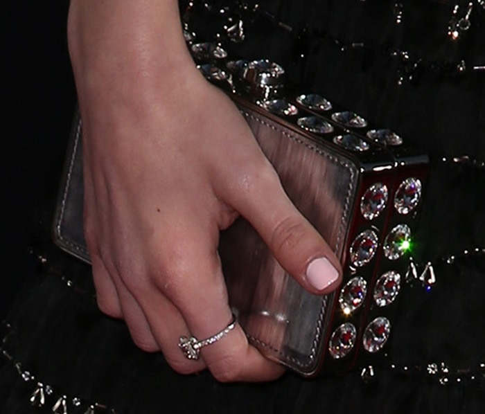 Kiernan Shipka's glittering Miu Miu stone-embellished hard case clutch