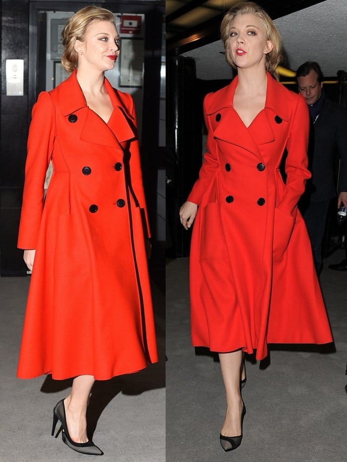 Natalie Dormer stuns in a bold, fire-red Dior coat with a tailored fit-and-flare silhouette, accented by oversized black buttons and paired effortlessly with sleek black pointed-toe pumps for a strikingly polished look