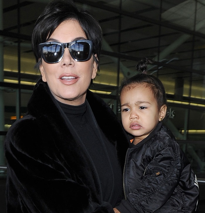 Kris Jenner wore an all-black ensemble consisting of a long velour coat and stylish sunglasses