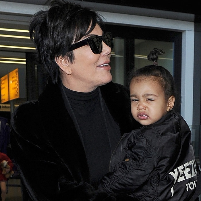 North West and Kris Jenner arrived at Heathrow airport in London on Monday and North was scowling directly at the paparazzi.