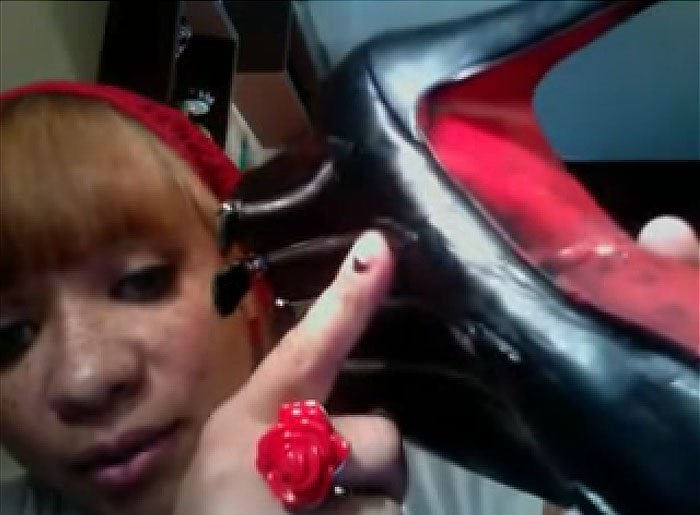 YouTuber Phoenix1018 showing the damages the professional shoe cobbler did to her brand new Christian Louboutin booties