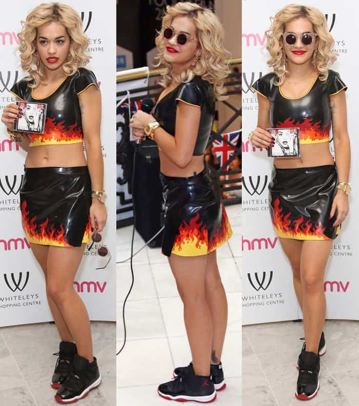 Rita Ora turns up the heat in a flame-print PVC crop top and skirt paired with Air Jordans