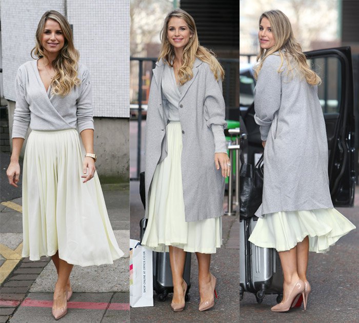 Vogue Williams wears a grey coat with a midi skirt