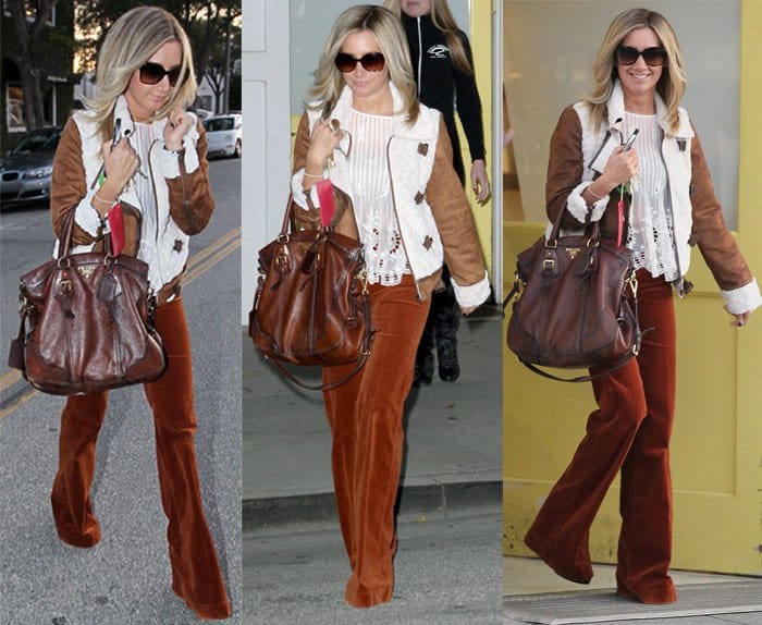 Retro Chic: Ashley Tisdale embraces the '70s vibe with suede flare pants, a jacket, and a lace top