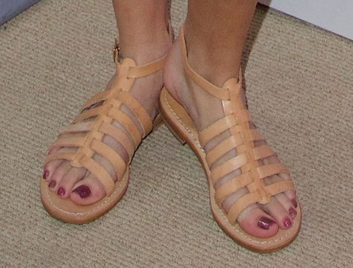 Bella Thorne shows off her plum pedicure in nude Capri Positano gladiator sandals