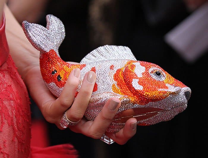 Blake Lively carrying an orange/silver Judith Leiber minaudière