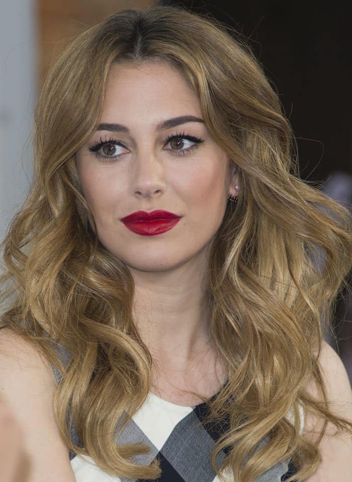 Blanca Suarez pairs her chic gingham ensemble with classic Hollywood waves and bold red lips for a stunning look