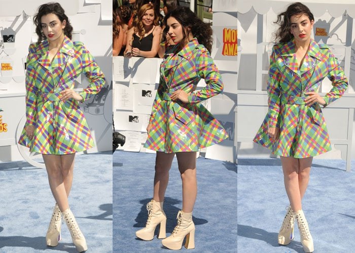 Charli XCX flaunts her legs in a rainbow-hued design Jeremy Scott Fall 2015 plastic raincoat