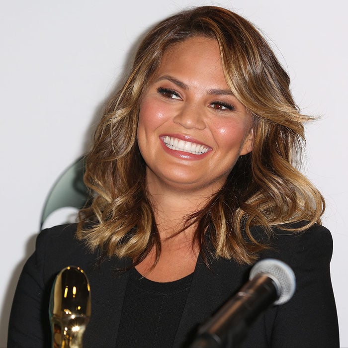 Chrissy Teigen flashing a million-dollar smile