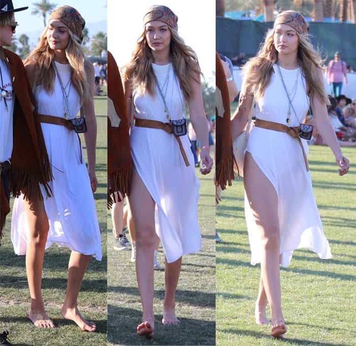 Gigi Hadid embraces boho vibes with a white high-slit dress cinched at the waist with a belt, accessorized with a turban and pouch necklace, while going barefoot at Coachella 2015