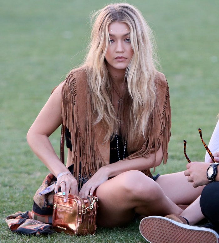 Gigi Hadid in a brown fringed vest at Coachella Valley Music and Arts Festival