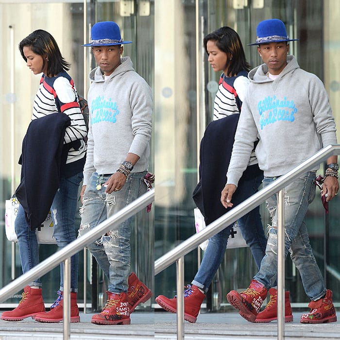 Pharrell Williams and wife Helen Lasichanh leaving their hotel in Manchester, England, on September 10, 2014