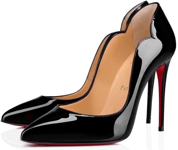 A curvy, scalloped counter and willowy stiletto heel dial up the drama on a pointy-toe pump finished with that iconic red sole