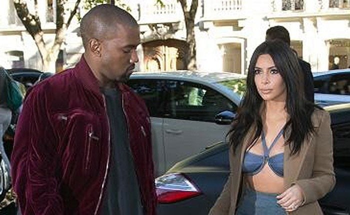 Kim Kardashian and Kanye West leave a building in Paris on April 14, 2015