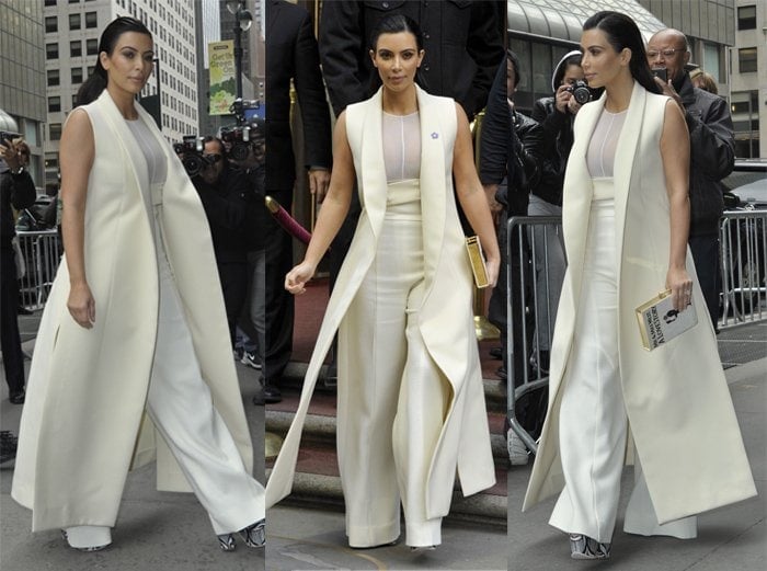 Kim Kardashian in an almost floor-length Narcisco Rodriguez Fall 2015 sleeveless coat with a sheer top and high-waisted, wide-legged trousers