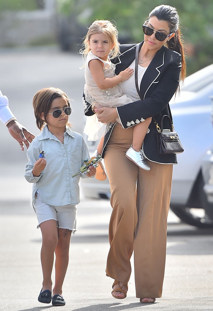 Kourtney Kardashian, Mason Disick, and Penelope Disick on their way to attend the Easter service at West Hills Church in the San Fernando Valley on April 5, 2015
